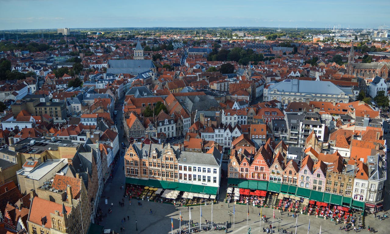Amazing aerial view of Markt square and aged typical buildings in historical center of Bruges on sunny day